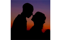 silhouetted couple at sunset