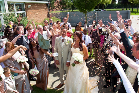 throwing confetti at couple after wedding