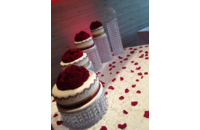 red and white wedding cakes on dessert table