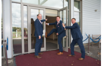 groomsmen shoving groom through open door