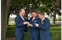 groomsmen checking out ring before wedding
