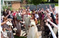 throwing confetti at couple after wedding