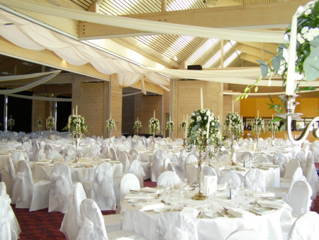 all white tables and decorations at wedding